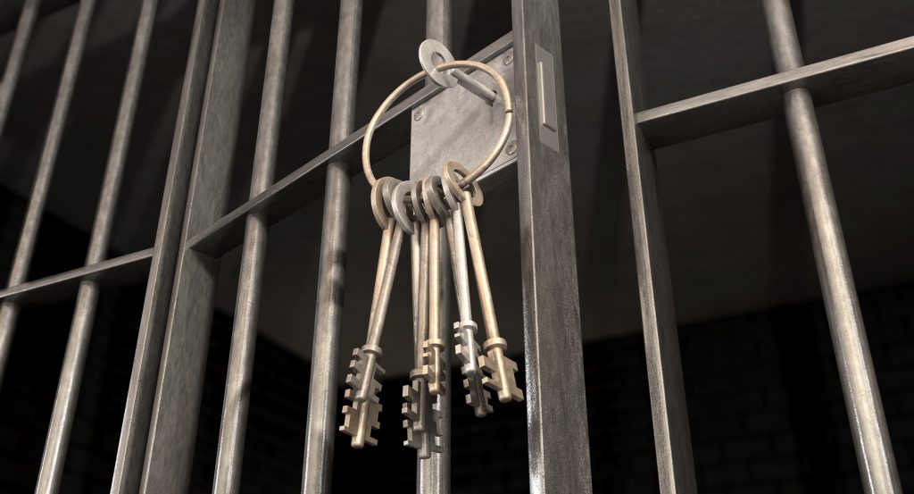 Jail Cell With Open Door And Bunch Of Keys